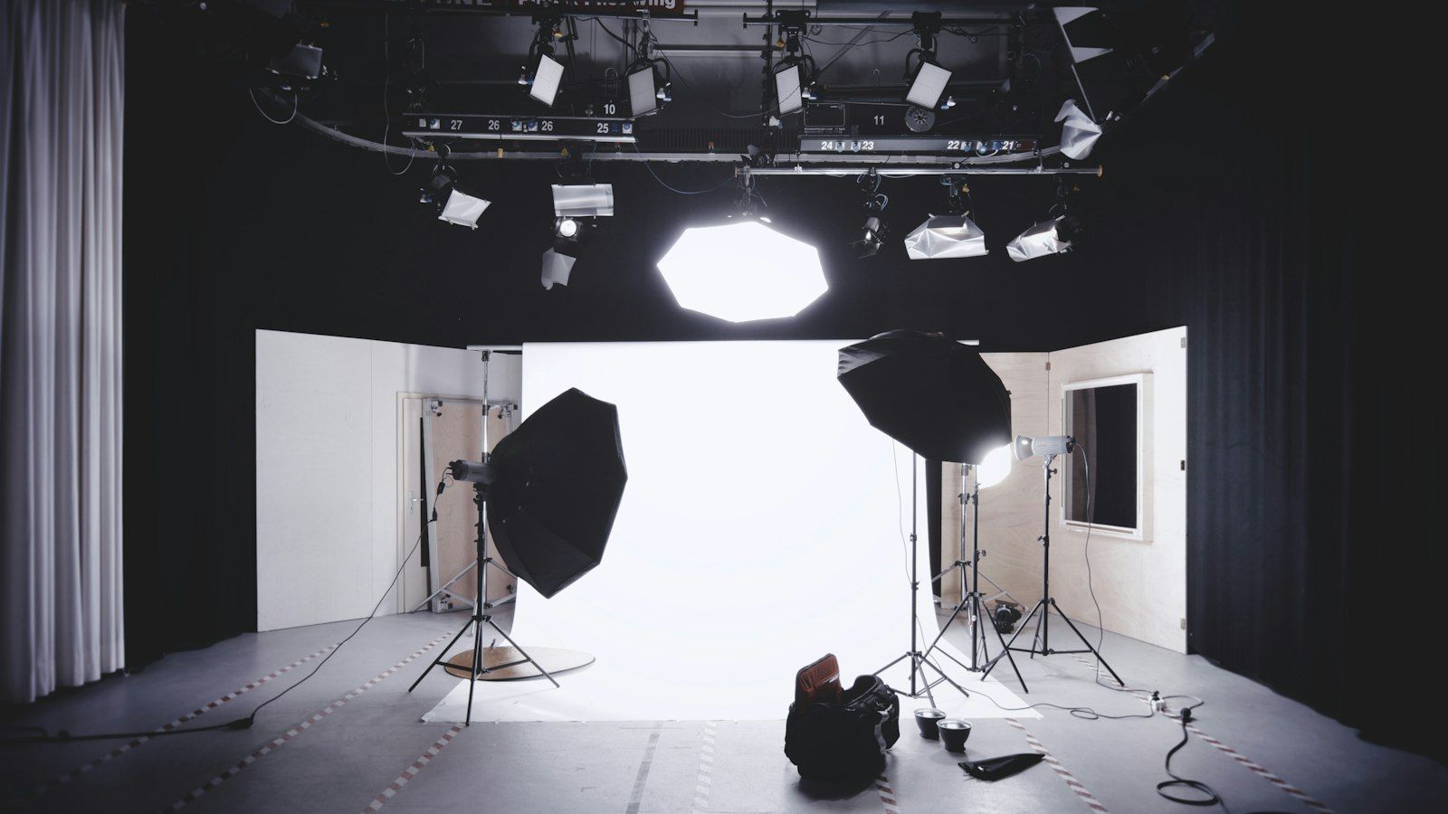 Empty studio with lighting rig and cyclorama wall