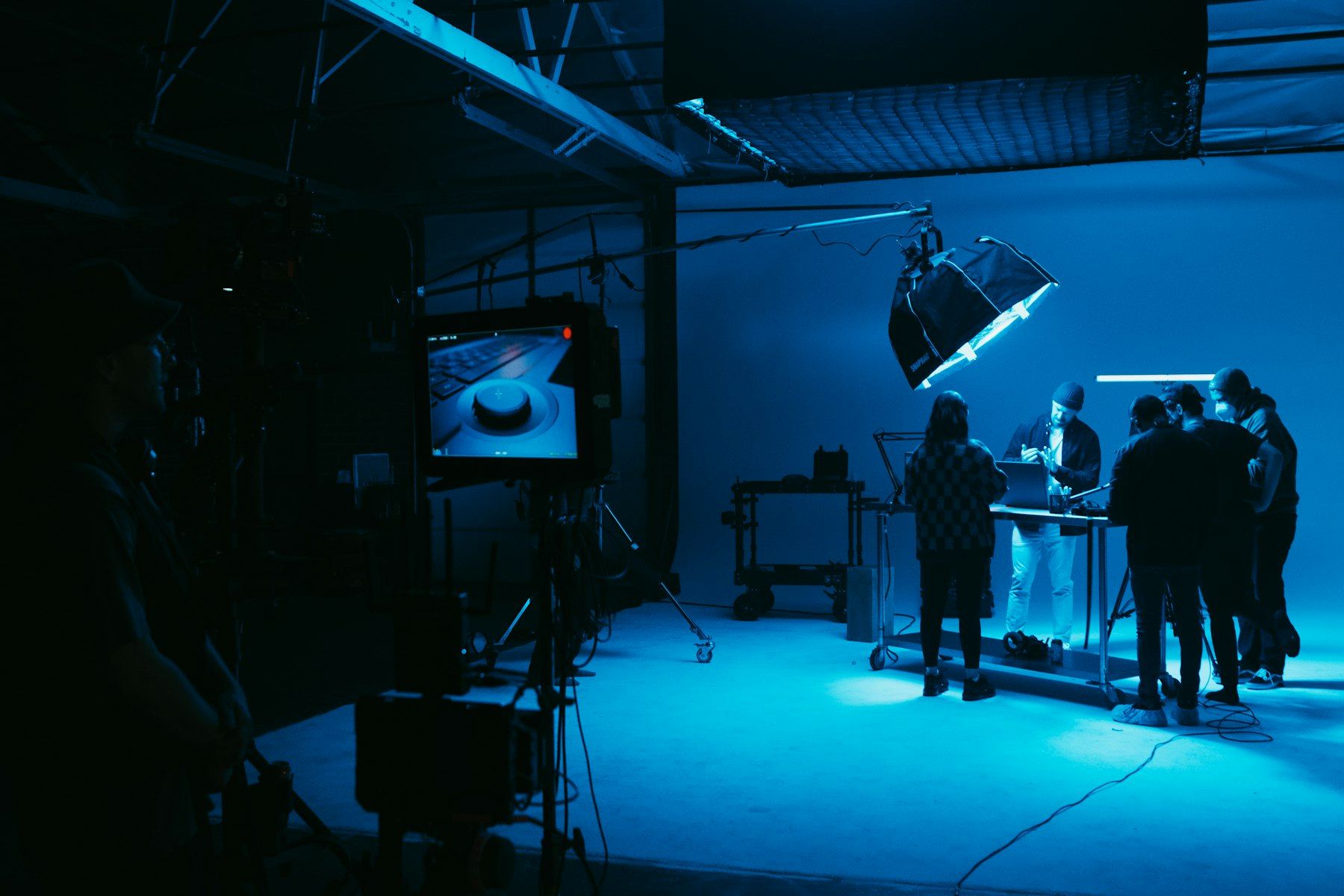 Crew on a soundstage lit in blue
